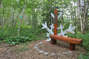 Bench and snowflake art along a nature trail, local park near Big Powderhorn Mountain.