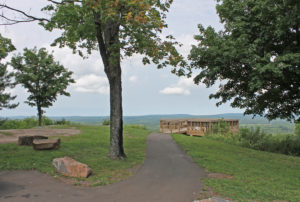 Scenic overlook at a park near Big Powderhorn Mountain, with a path leading to a viewing platform.