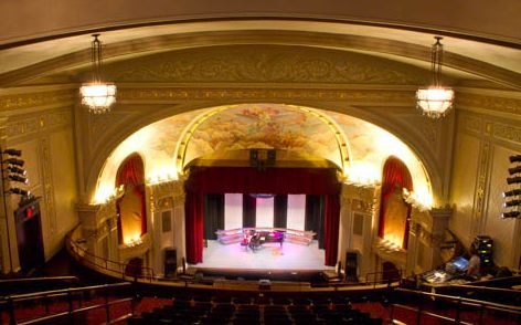 Interior view of a grand theater, possibly a venue for attractions near Big Powderhorn Mountain.