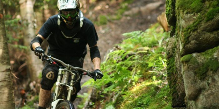Mountain biker on a trail near Big Powderhorn. Upper Peninsula Michigan hiking and biking trails.