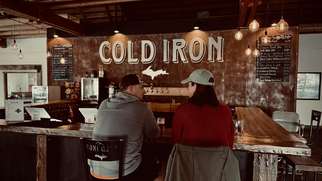 Couple at Cold Iron bar, Upper Peninsula winter activities