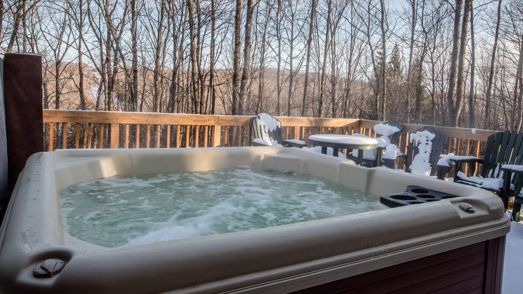 Hot tub on a snowy deck in the Upper Peninsula during winter