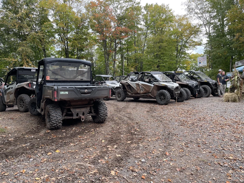 ATV and ORV vehicles parked near trails at Big Powderhorn Mountain, Upper Peninsula