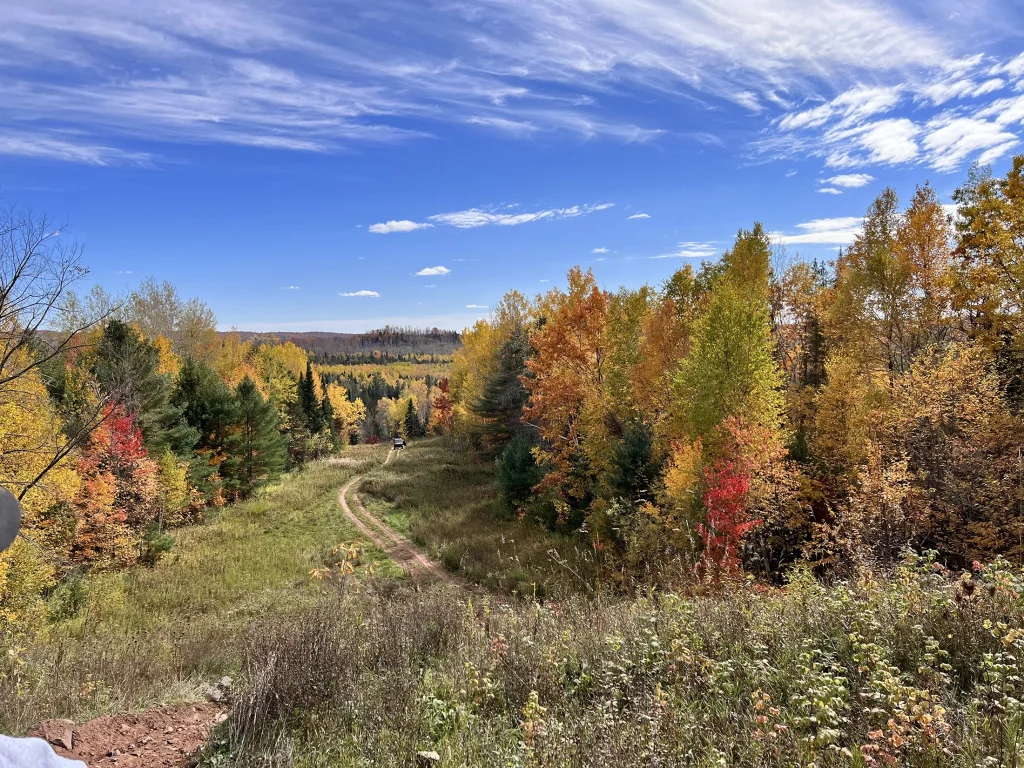 ATV trail winds through colorful autumn trees near Big Powderhorn Mountain, UP